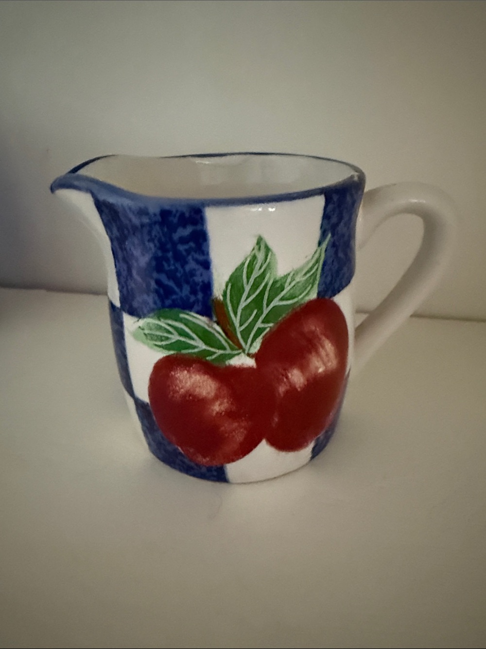 Hand-Painted Red Apple Ceramic Pitcher with Blue Check Design